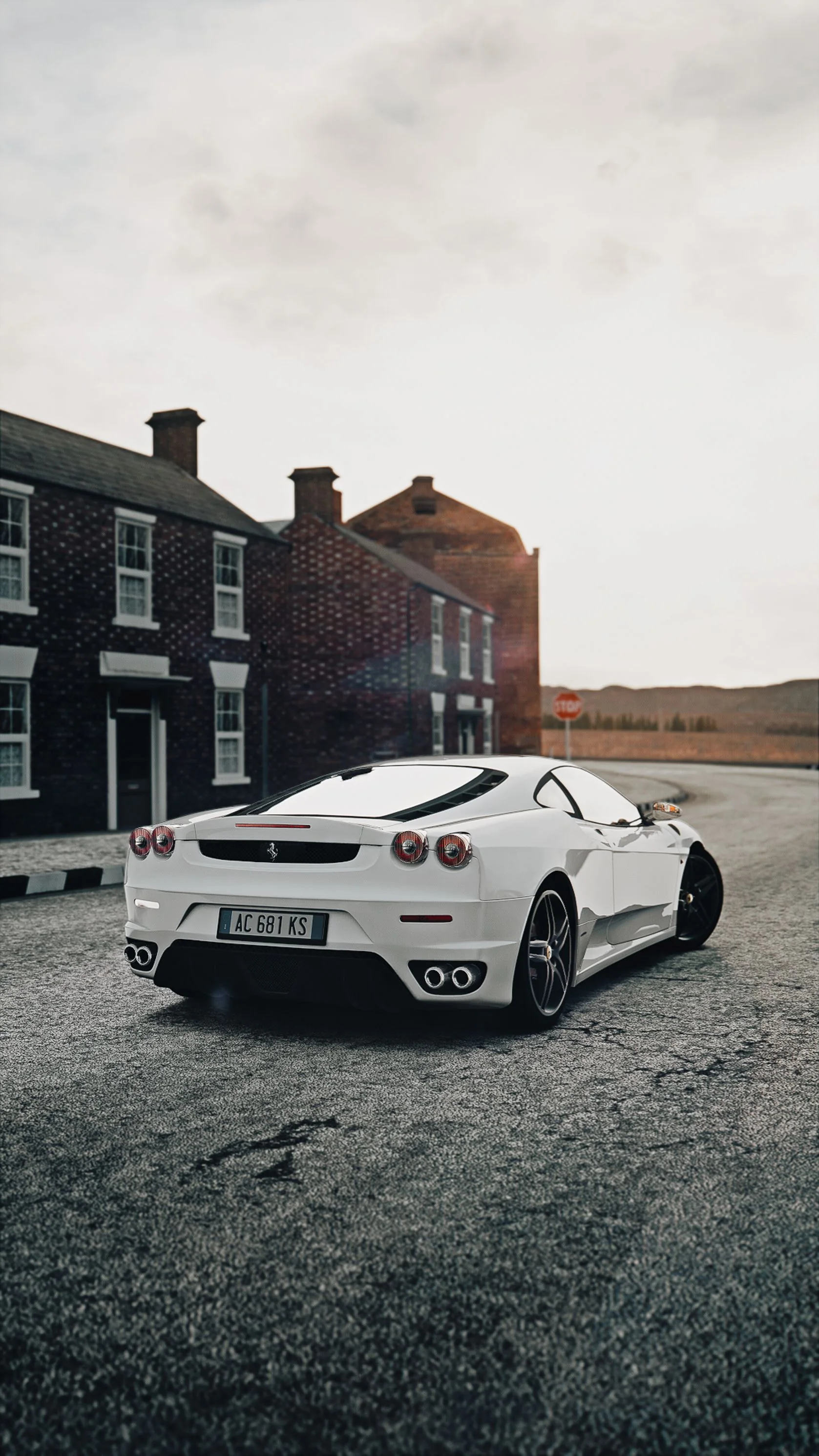 White supercar outside an elegant estate